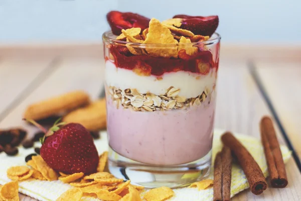 Yogurt with strawberries and corn flakes