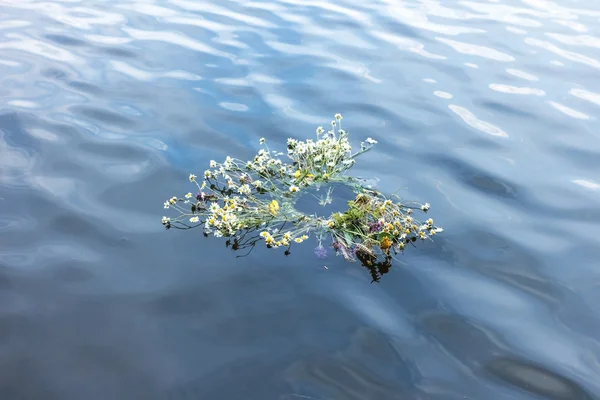 A wreath of flowers in the river