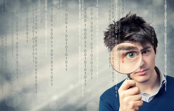 Young Man with magnifying glass