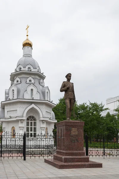 Monument to Alexander Kotomkin-Savinskaya on the background of the Chapel of All Saints in the land of the fallen Russian. The Republic of Mari El, Yoshkar-Ola, Russia. 05/21/2016