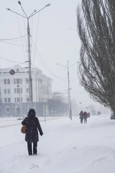People make their way through heavy snow, poor visibility. Snow storm in the city of Cheboksary, Chuvash Republic, Russia. 01/17/2016