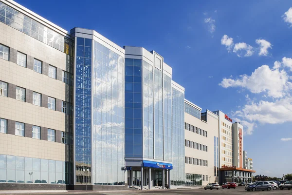 A large, modern office building of the Russian bank VTB 24, and parking in front of the building. City Cheboksary, Chuvash Republic, Russia. 08/07/2016