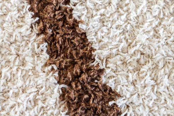 White carpet with a brown stripe texture