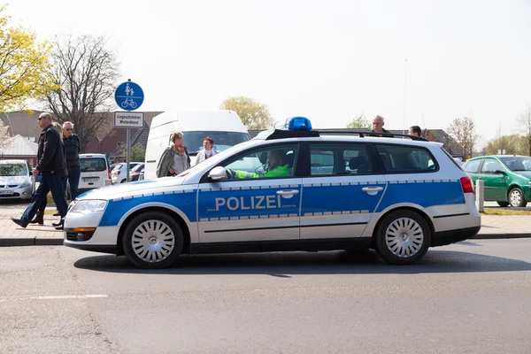 German police car drives on a street