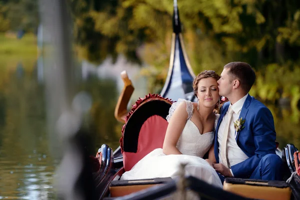 Beautiful bride and groom on gondola