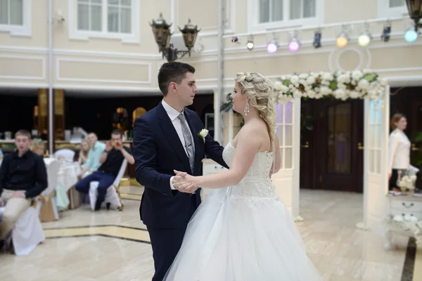 Wedding couple dancing in restaurant