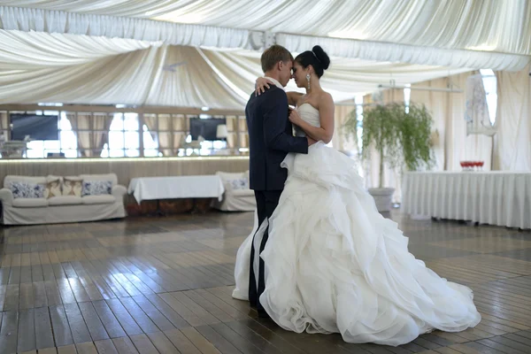 Wedding couple dancing in restaurant