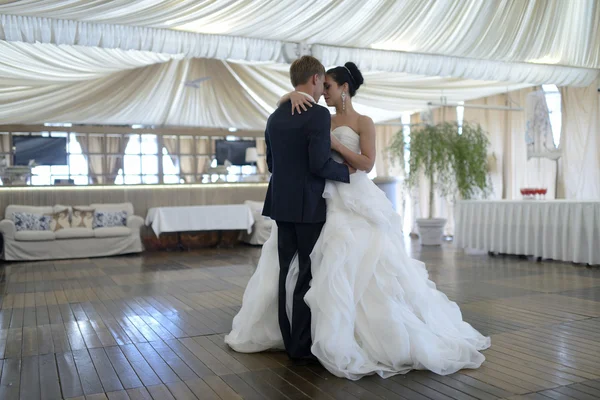 Wedding couple dancing in restaurant