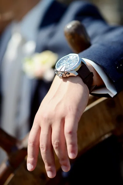 Groom wearing wrist watch