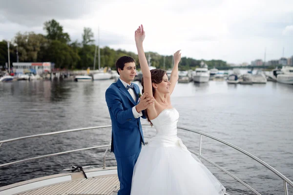 Wedding couple dancing on yacht