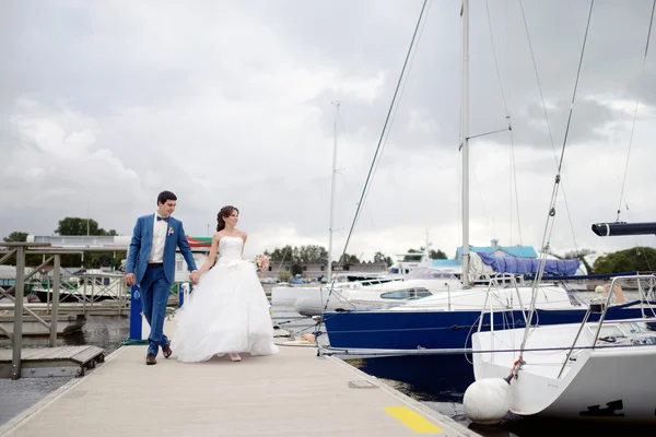 Beautiful wedding couple on pier