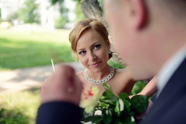 Beautiful wedding couple coloring flowers