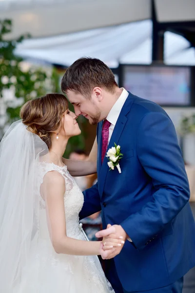 Wedding couple in restaurant dancing