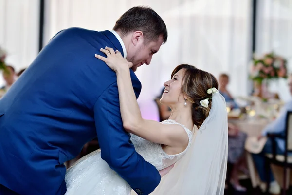 Wedding couple in restaurant dancing