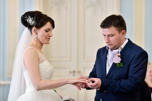 Bride and groom registering marriage