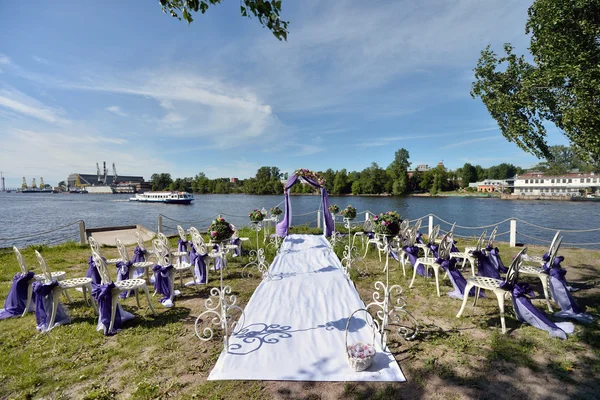 Purple wedding arch with flowers