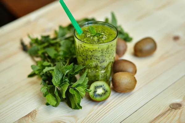 Fresh green smoothie with kiwi and mint . Love for a healthy raw food concept. Healthy eating. Fruit Smoothies. Kiwi.