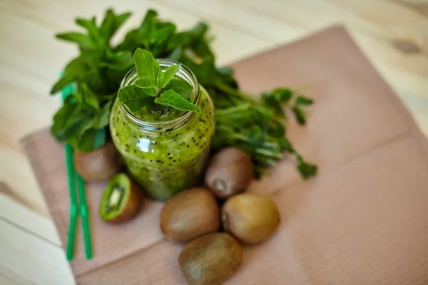 Fresh green smoothie with kiwi and mint . Love for a healthy raw food concept. Healthy eating. Fruit Smoothies. Kiwi.