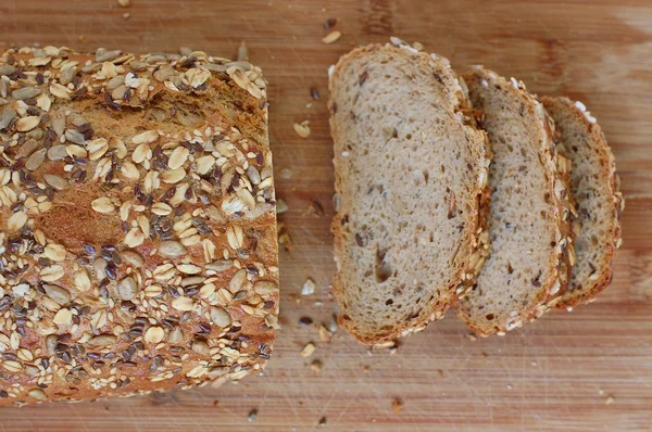 Wholegrain bread with seeds on the wood