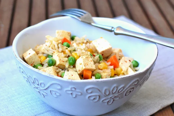 Healthy vegan meal with tofu,peas,carrot,sweet corn and whole grain rice