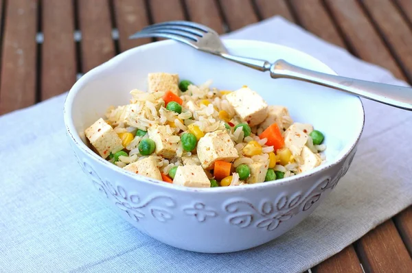 Healthy vegan meal with tofu,peas,carrot,sweet corn and whole grain rice