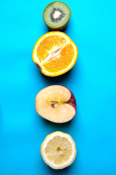 Healthy fruits on a blue background from above