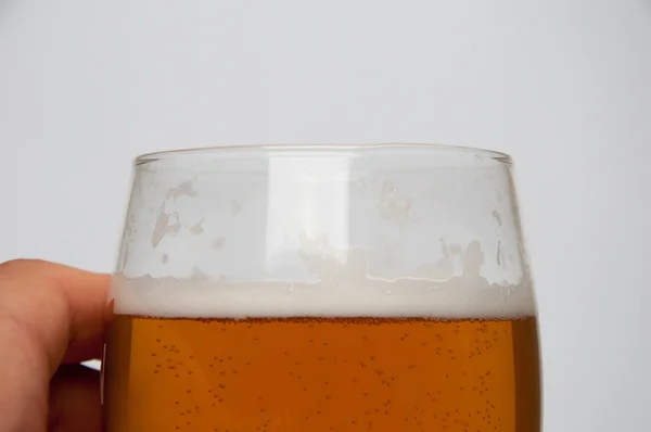 Glass of light beer and male hand , isolated on a white backgrou