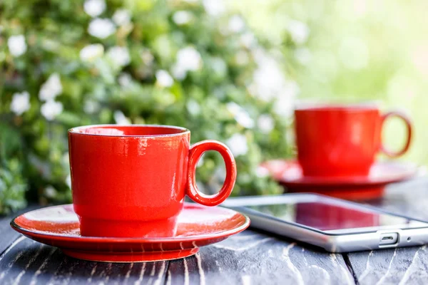 Cup of coffee on a wooden  board