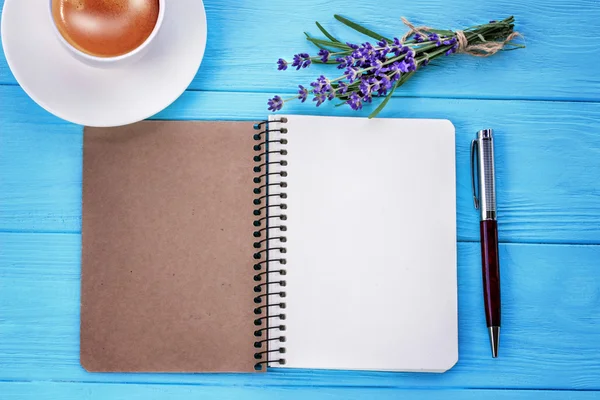 Blank white notebook, bunch of lavender and cup of coffee