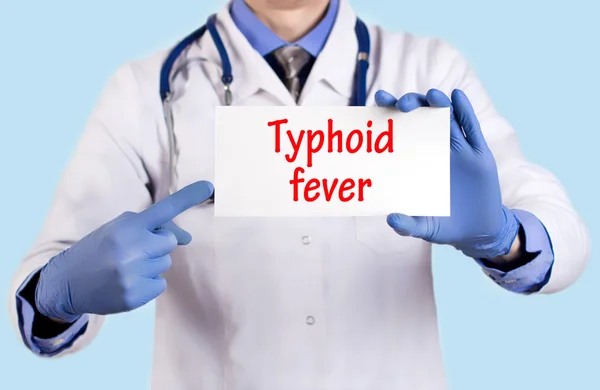Doctor keeps a card with the name of the diagnosis - typhoid fever