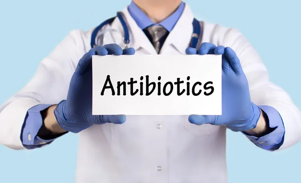 Doctor keeps a card with the name of the antibiotics