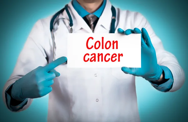Doctor keeps a card with the name of the diagnosis - colon cancer