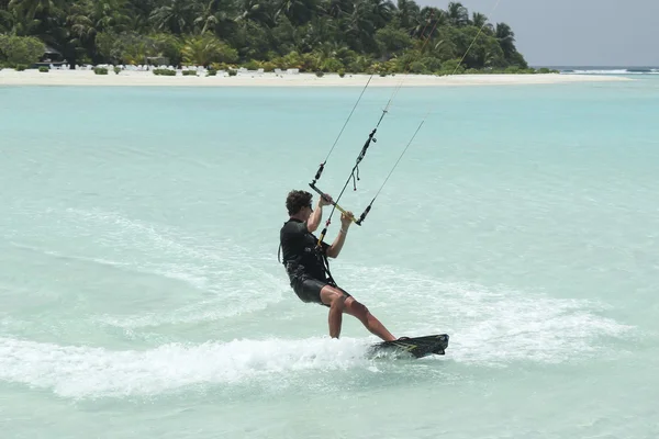 South Male atoll, Maldives, 13.March 2014: Man try kiteboarding