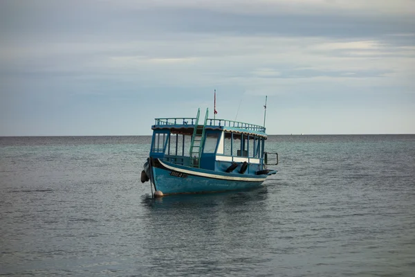 The boat costs on an anchor in a bay of the Maldivian island