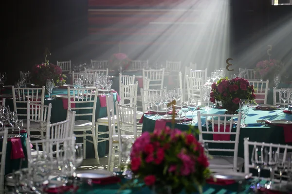 Banquet hall or other function facility set for fine dining.