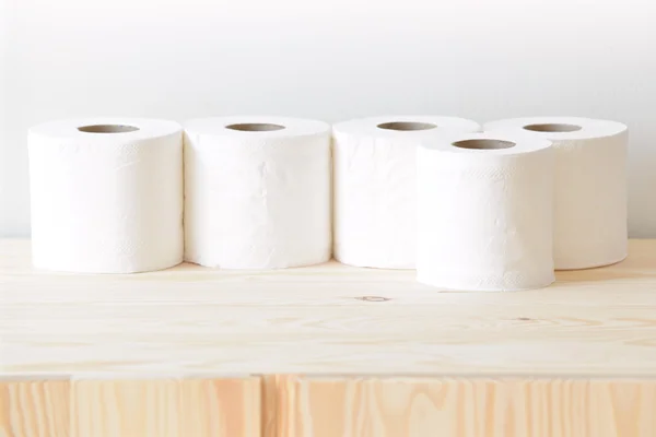 Many rolls of paper towel on the cupboard at home