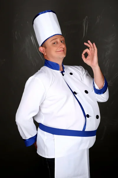 Portrait of chef and hand doing gesture is all right