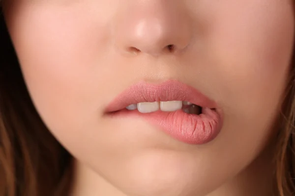 Miss biting her lip. Close up