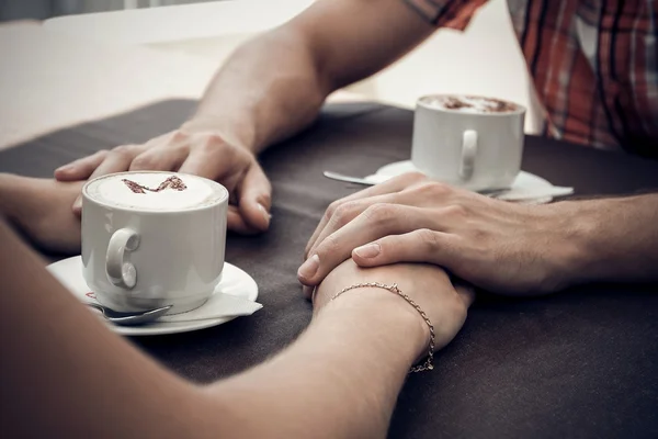 Young couple meeting in a cafe.