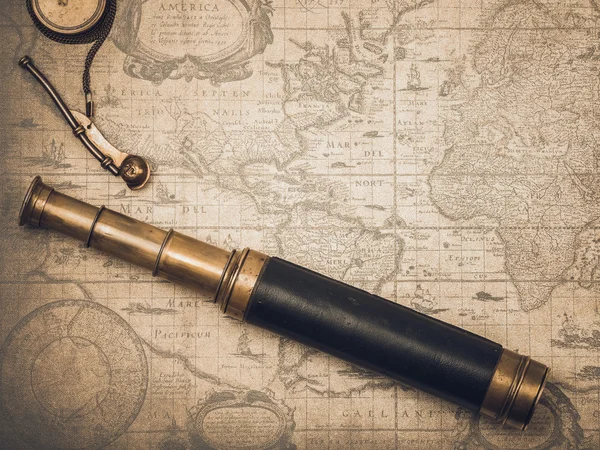 Vintage spyglass and whistle of the boatswain.