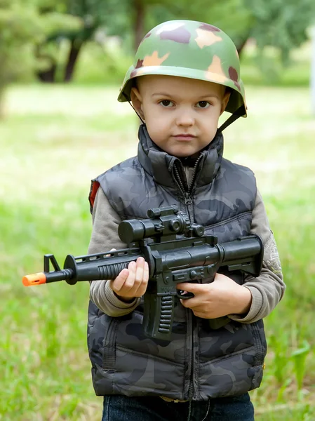 Boy with toy gun outdoor