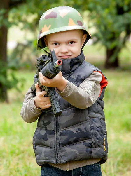 Boy with toy gun outdoor