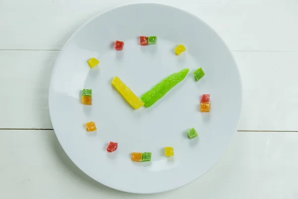 Fruit clock with candied fruits