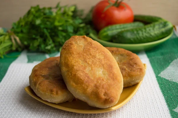Fried pies on a plate.