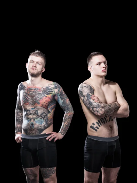 Mixed martial artists before a fight on black background