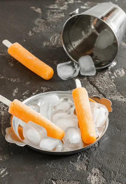 Popsicle on a stick, ice, ice bucket