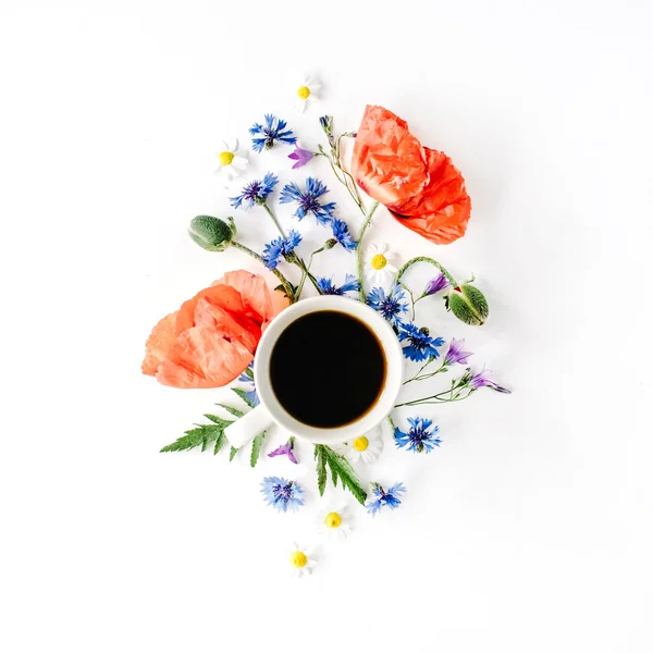 Coffee mug and poppies