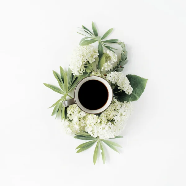 Mug and white hydrangea flowers bouquet