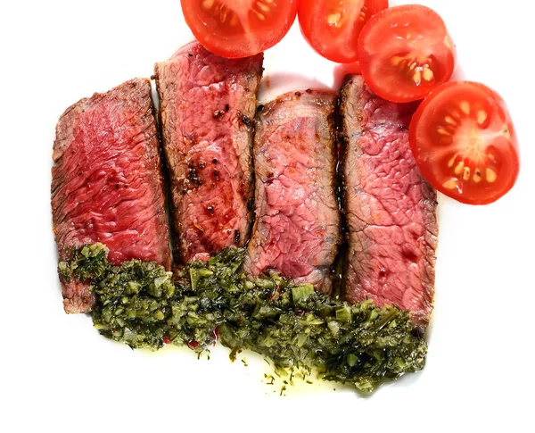 Slices of steak with tomatoes