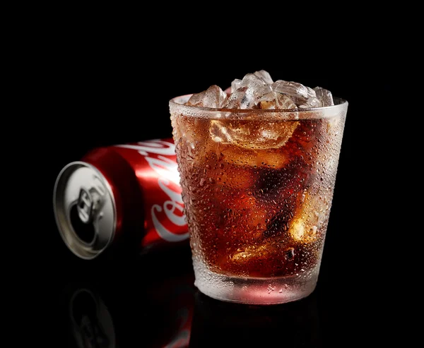 Can and glass of Coca-Cola